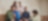 Five people sit on wooden steps in smart casual attire