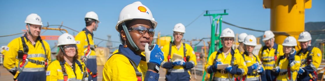 A female Shell engineer leading her team at an operational site.