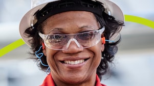 Woman in Shell Safety Helmet Smiling