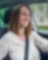 Happy mother driving baby in back carseat