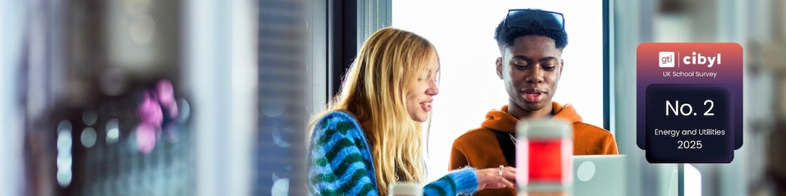 Two young students working in lab with computer with Cibyl award icon embedded.