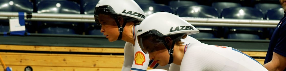Two professional cyclists on a track