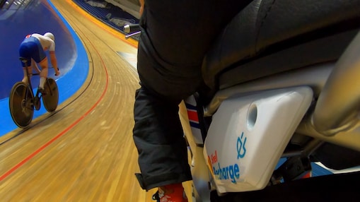 Group of professional cyclists on a track starting line