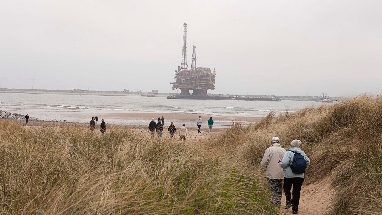 Spectators watching Brent Delta coming to shore