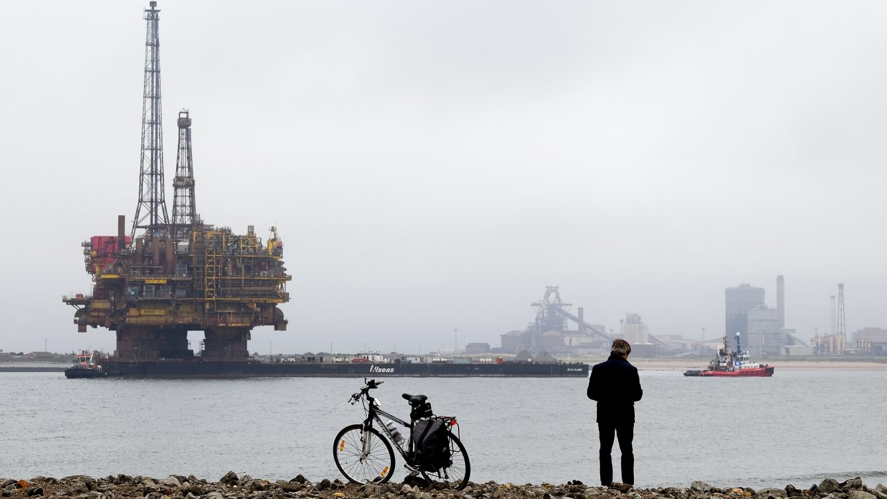 Passers-by stop to watch