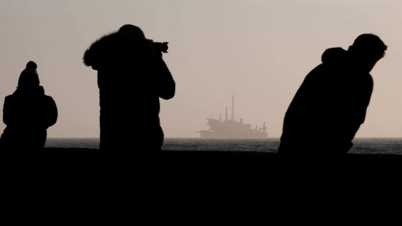 Spectators in awe of the Pioneering Spirit and Brent Delta