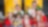 Young school children huddles smiling with Shell employees, in Shell hard-hats