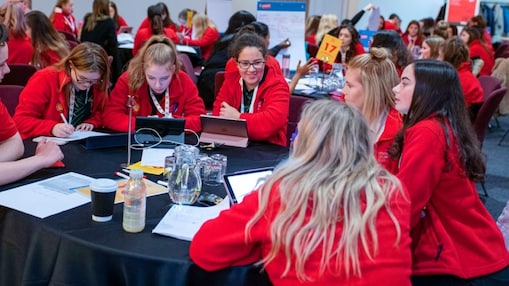 Teams of girls working on group engineering projects