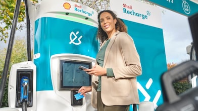 Man using charge card at a Shell Recharge Station