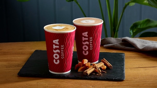 Two costa drinks presented on a wooden table
