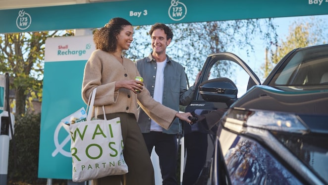 Man opening door for woman