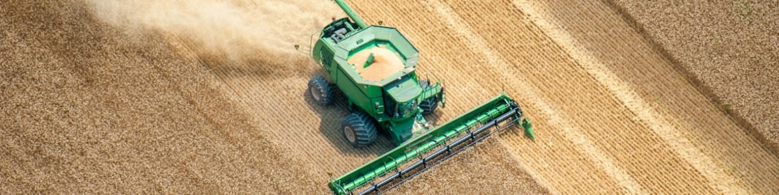 Aerial view of combine harvesting wheat