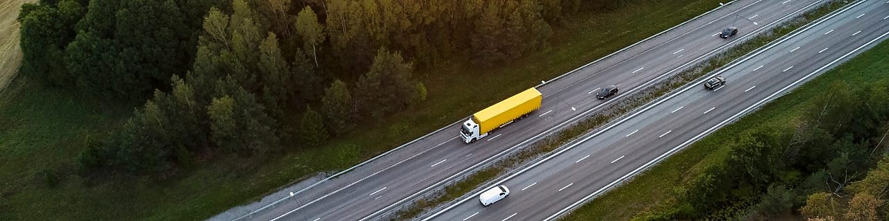 birdseye view of fleet lorries, cars and vans on a motorway