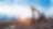 Excavator in a construction site with the city in background
