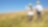 Two workers in hard hats overlooking a field