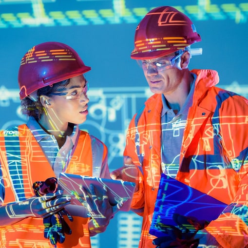 Two construction workers in hard hats in a digital landscape