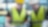 Two construction workers in hard hats and high vis jackers