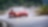 Red maserati climbing up mountain-road