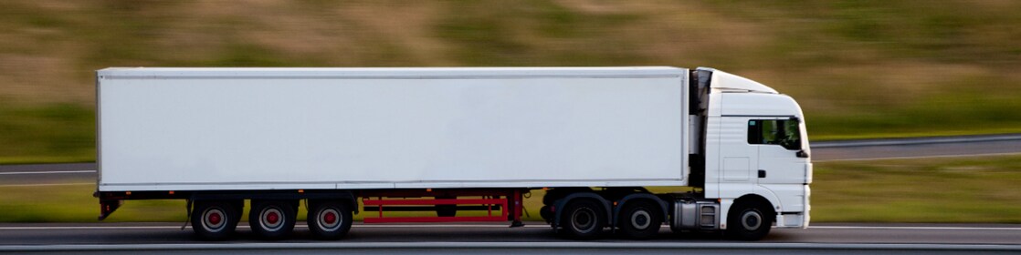 Lorry on motorway Blurred motion truck seen driving on road.