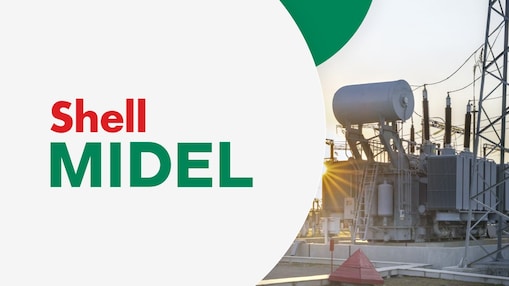 A transformer in the sunset. The words "Shell MIDEL" are displayed on the left against a light grey background.
