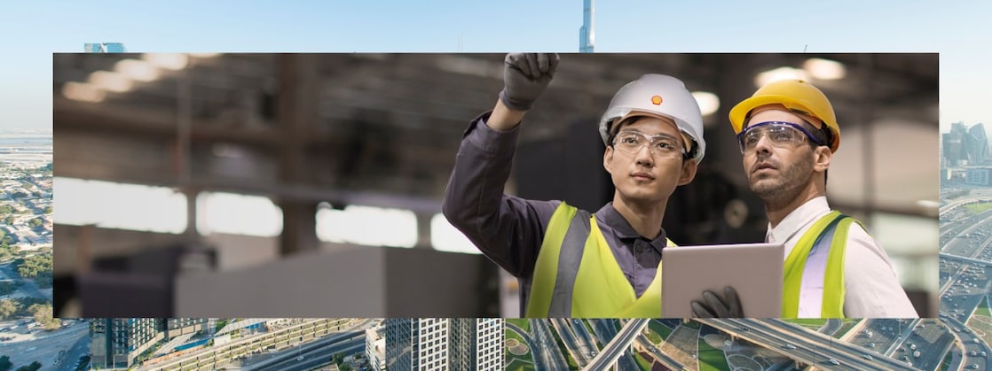Two engineers in hard hats assessing