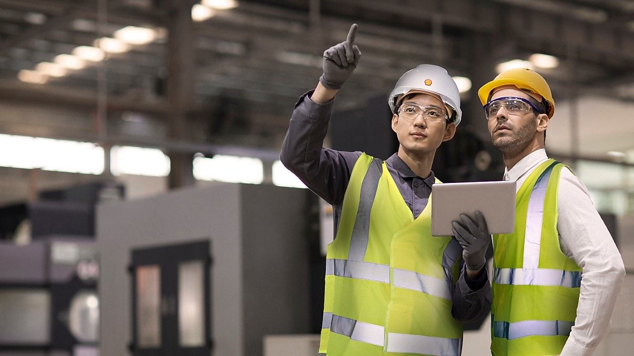  Two engineers in hard hats assessing