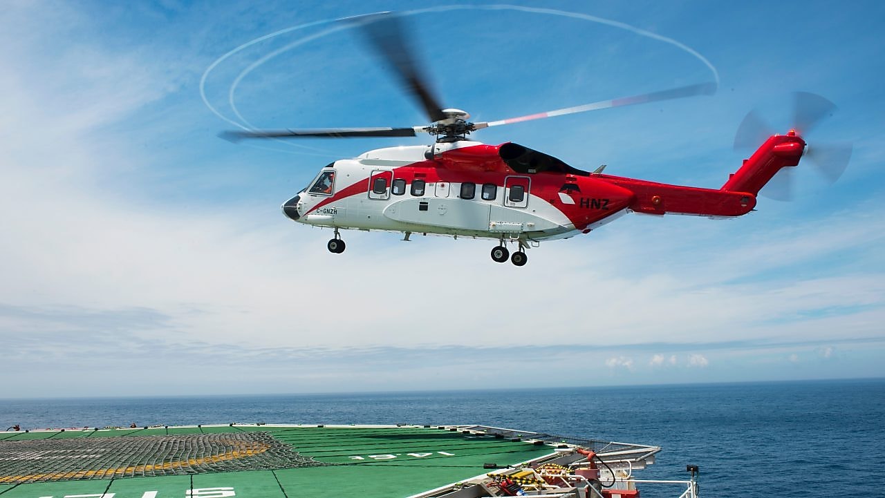Helicopter landing at rig helipad