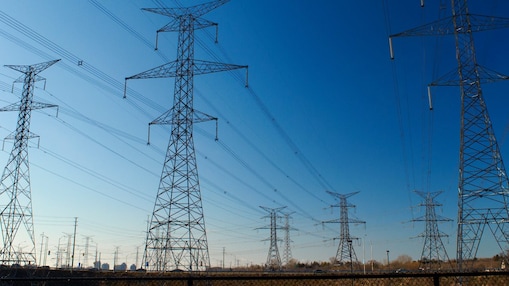 Electricity transmission network with high-voltage power lines delivering energy across the grid.