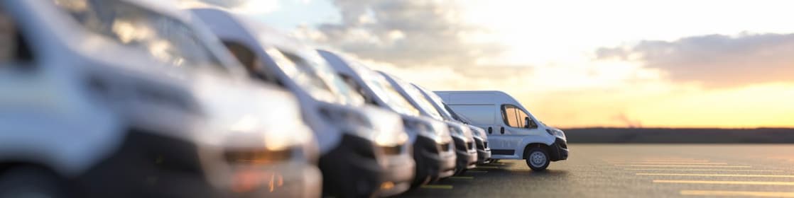 Row of new vans in a parking bay
