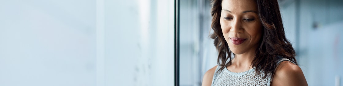 Woman smiling looking in mobile