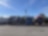 Three heavy goods trucks parked side by side in parking bays.