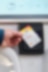 Male Shell customer tapping his Shell card after charging his electric vehicle at a Shell forecourt.