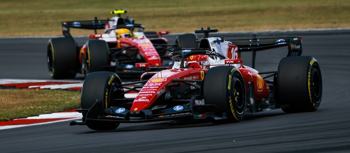 A red Scuderia Ferrari F1 car on a track with a distorted perspective to elongate the length of the track