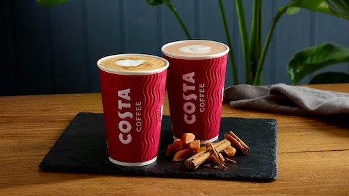 Two costa drinks presented on a wooden table