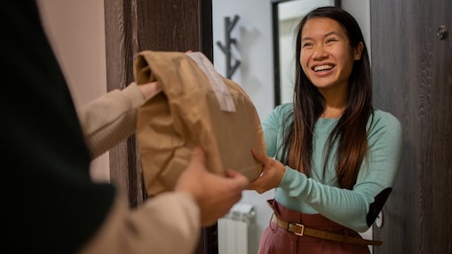 Woman receiving a food delivery