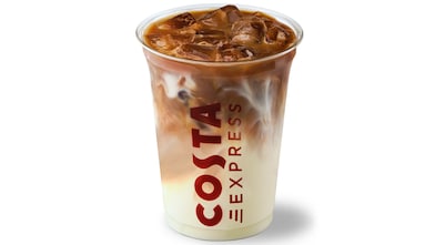 Image shows Costa Express iced latte in a transparent plastic Costa Express cup.