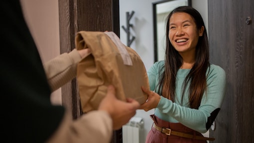 Woman receiving a food delivery