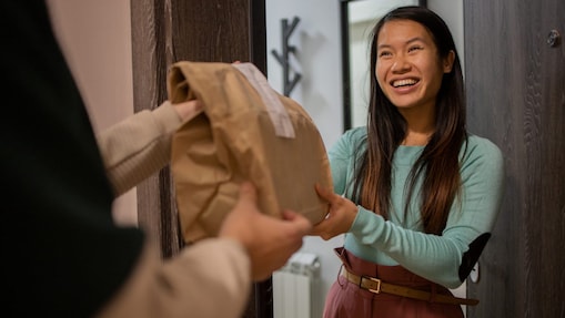 Woman receiving a food delivery